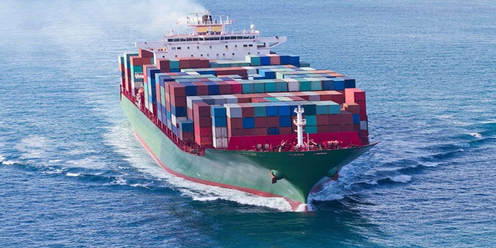 A loaded container ship on open water