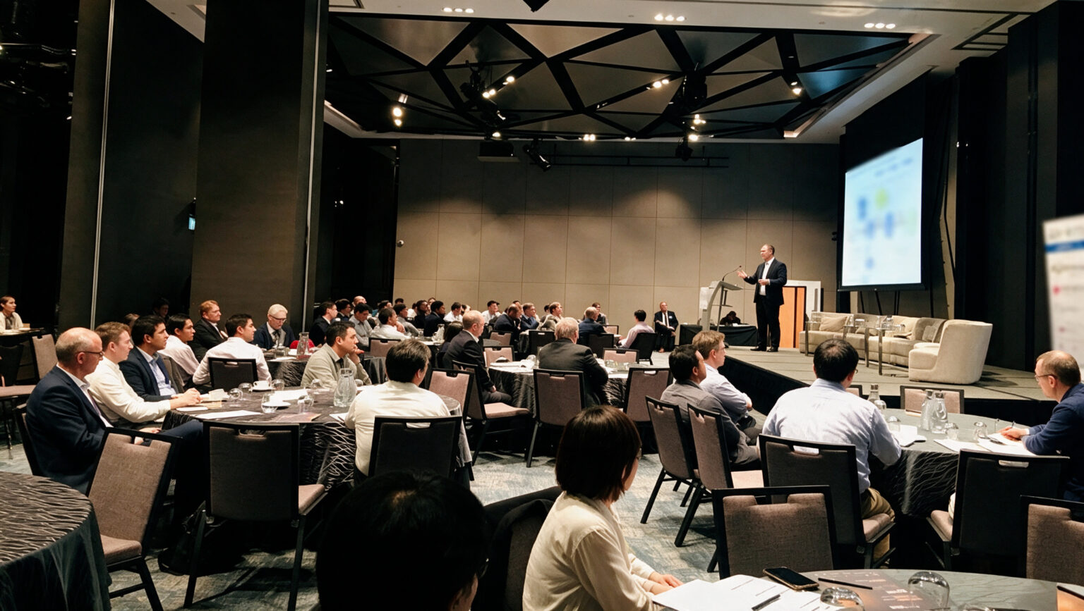 A speaker delivering a keynote presentation at a business conference