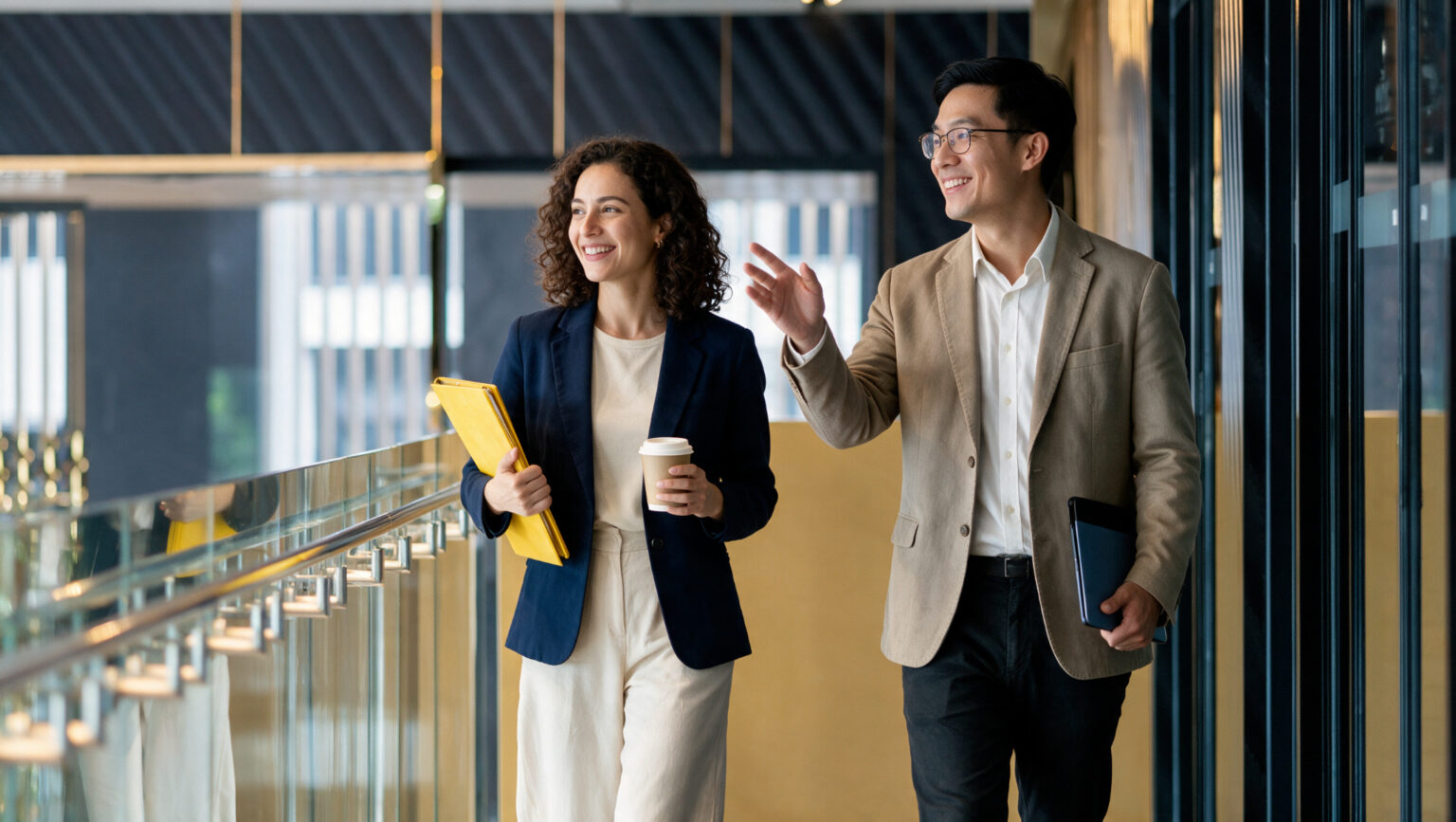 Two professionals in conversation while walking